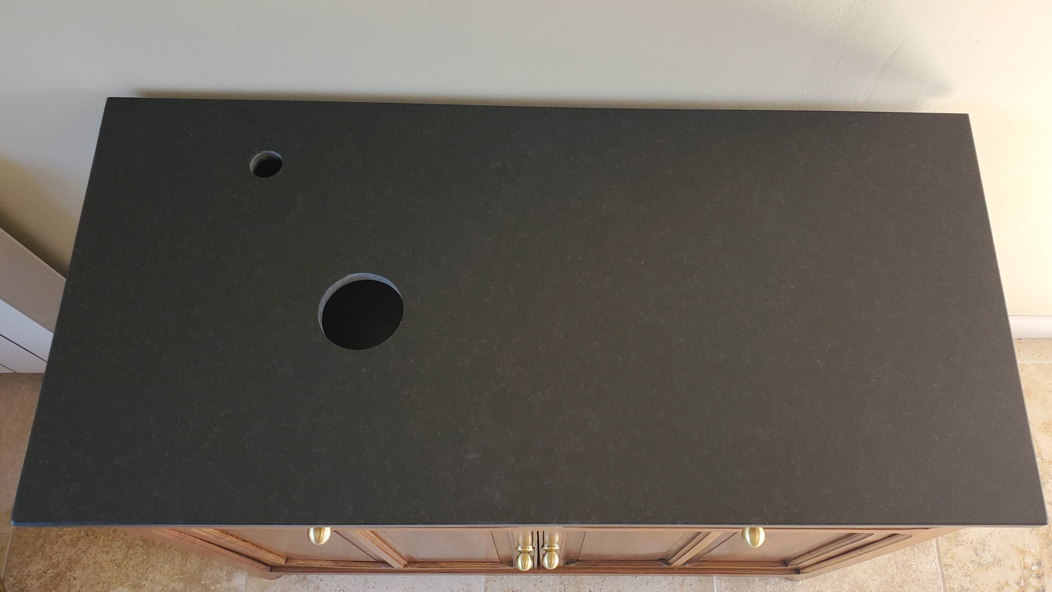 Vanity unit in solid walnut and Zimbabwean granite.