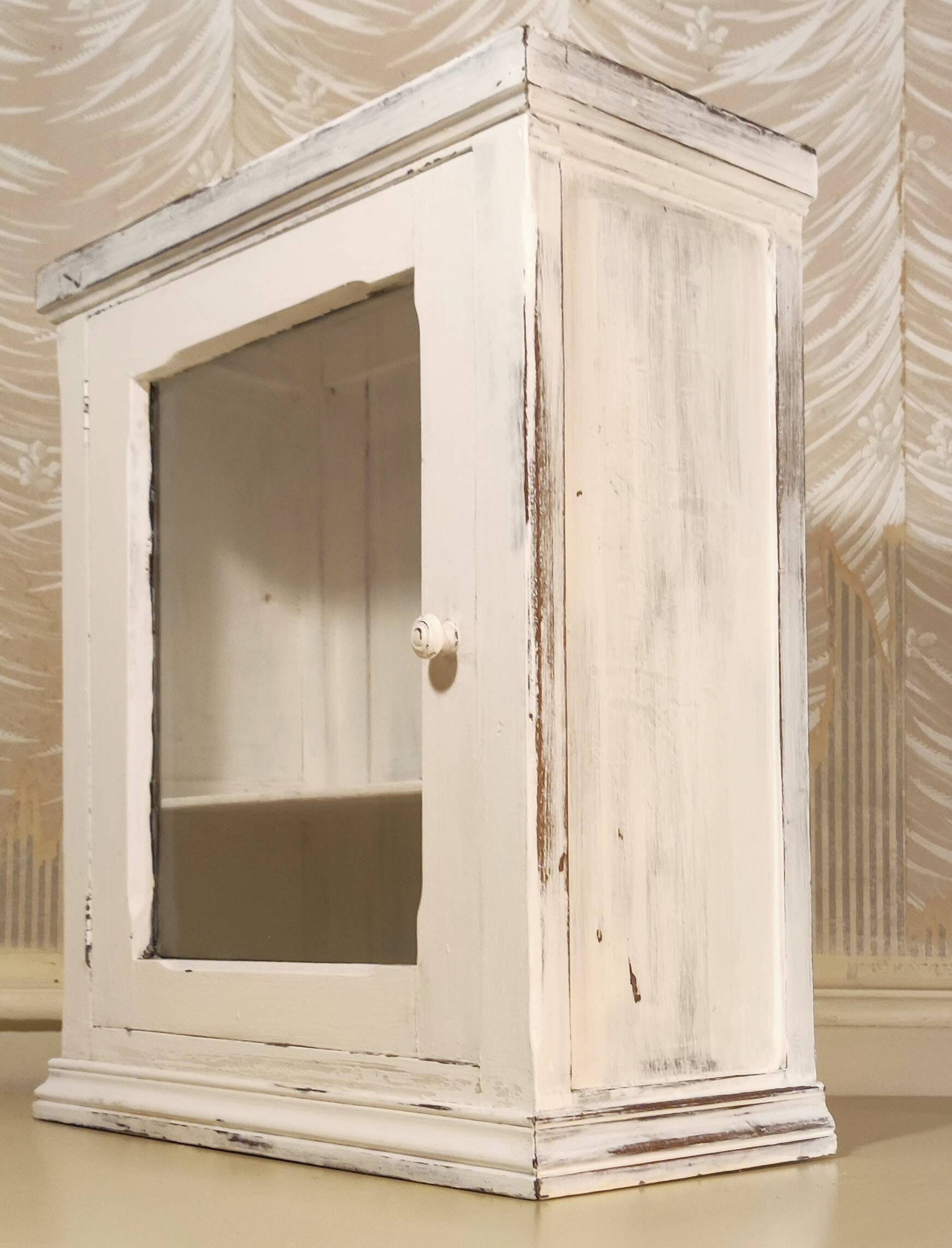 Glazed wall-mounted medicine cabinet in patinated wood