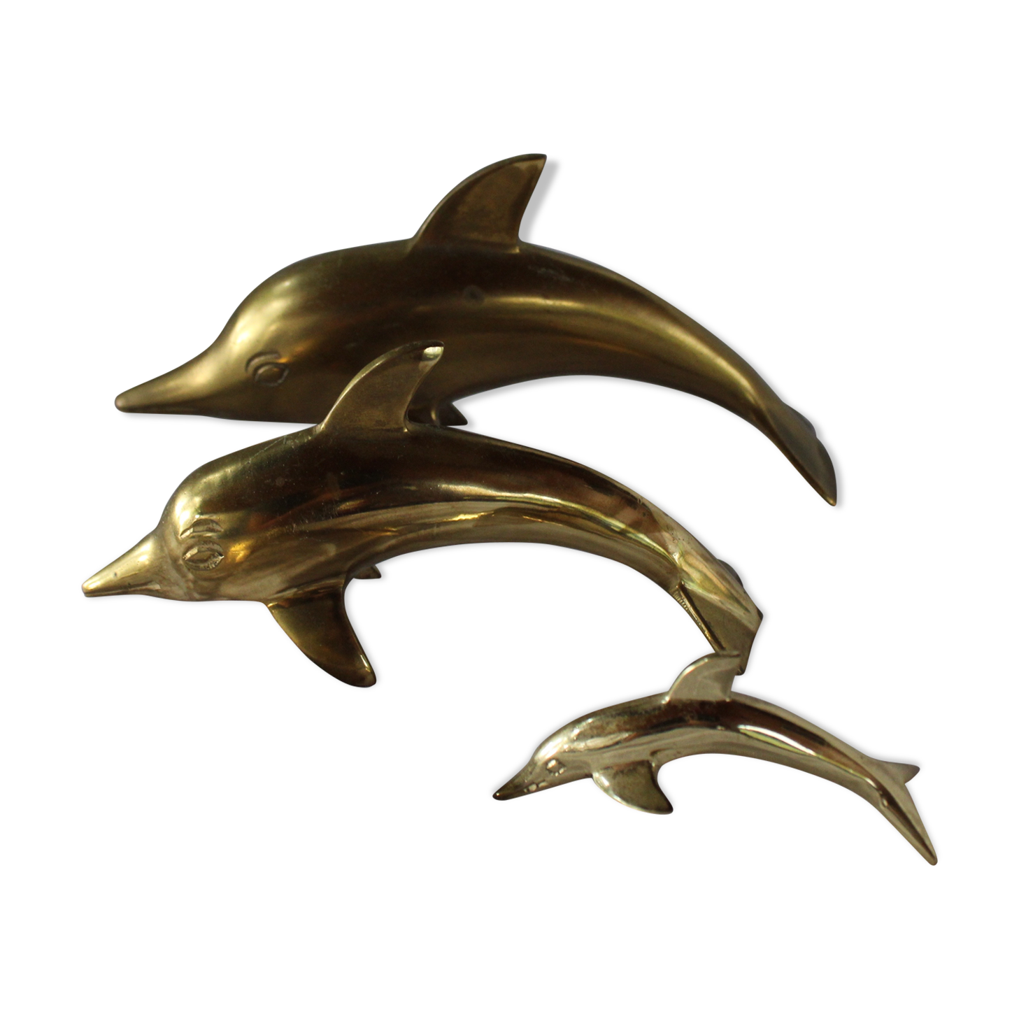 Family of dolphins in vintage brass