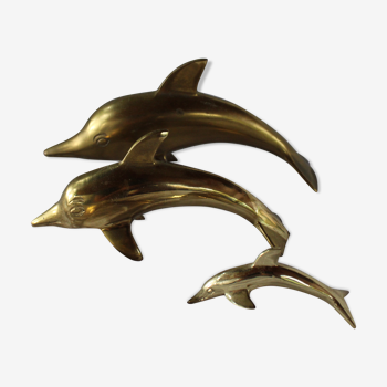 Family of dolphins in vintage brass