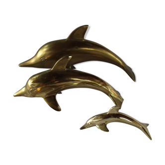 Family of dolphins in vintage brass