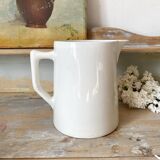Old white earthenware jug