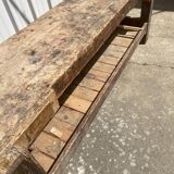 Old carpenter's workbench with press