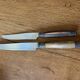 Service of 24 Art Deco knives with wooden handles and engraved metal ferrules from 1930.