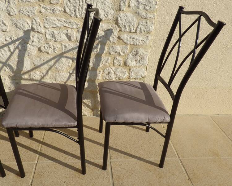 4 black metal chairs with high backs and gray suede tops