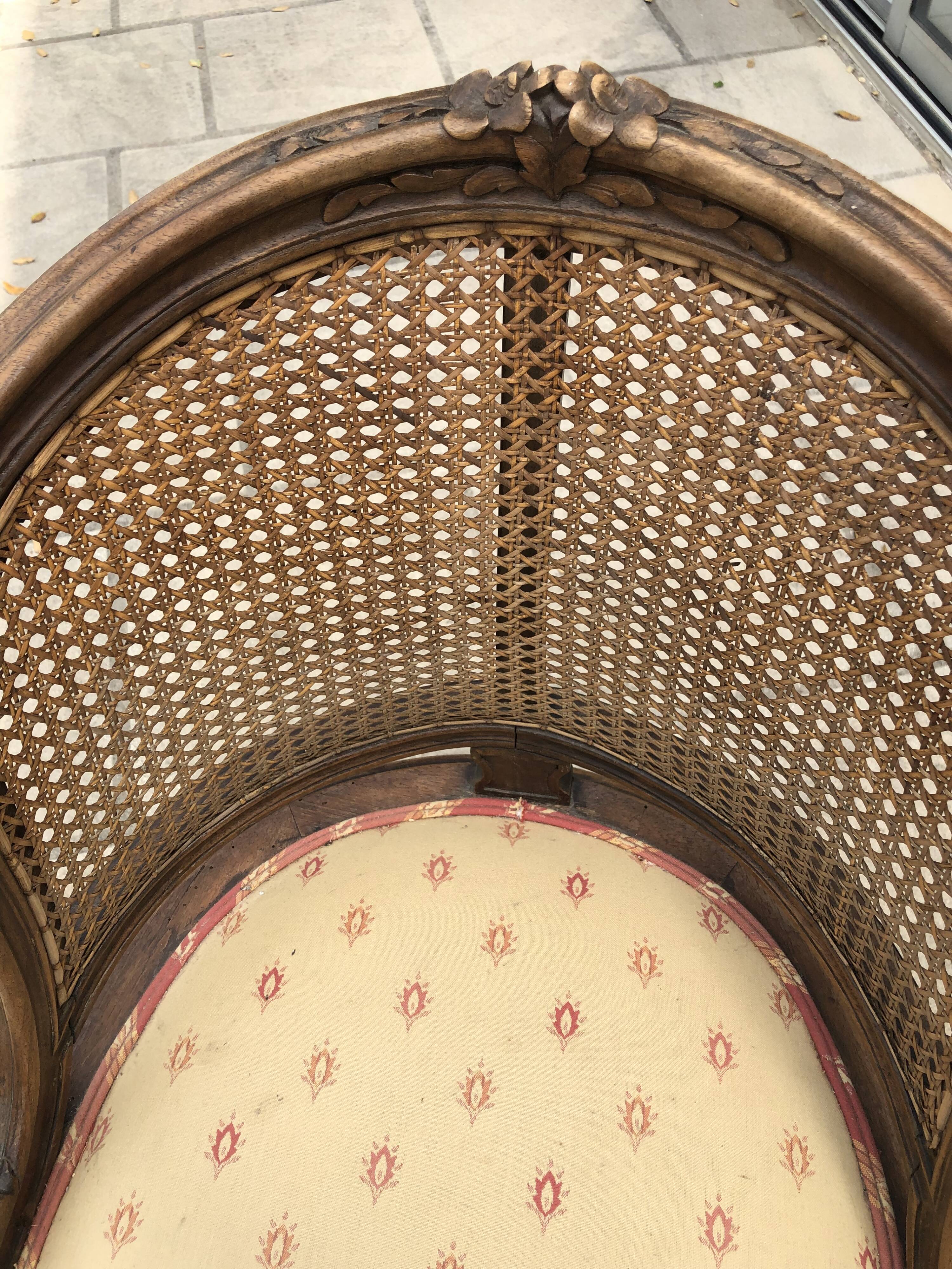 Old wooden armchair and cannage