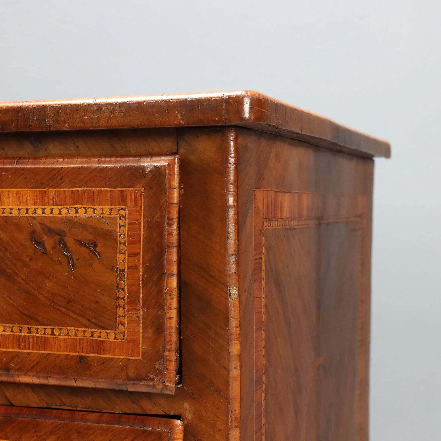Antique neoclassical walnut commode from the 18th century.