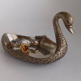 Metal swan emptier