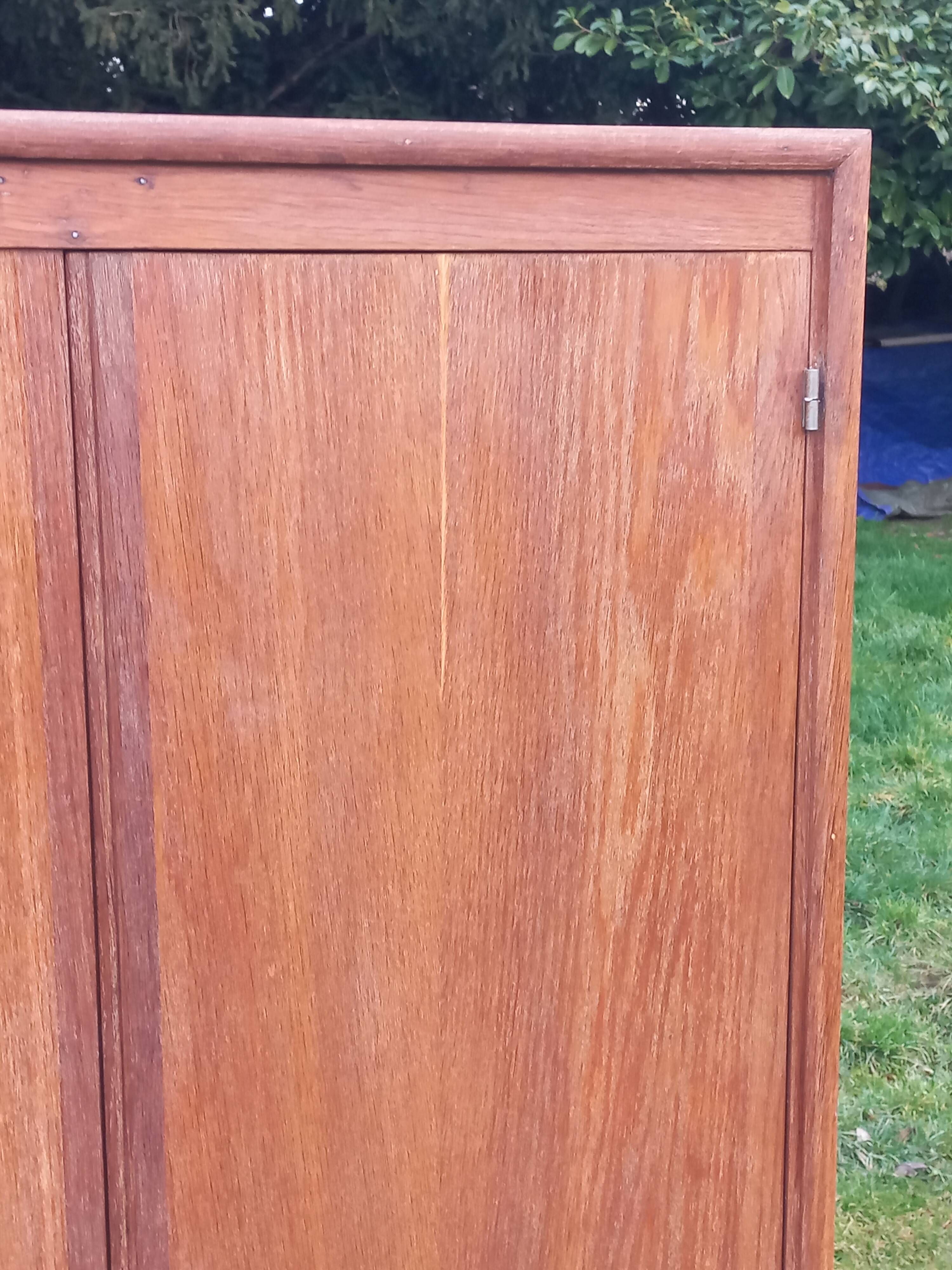 Vintage oak wardrobe with metal legs from the 1950s.