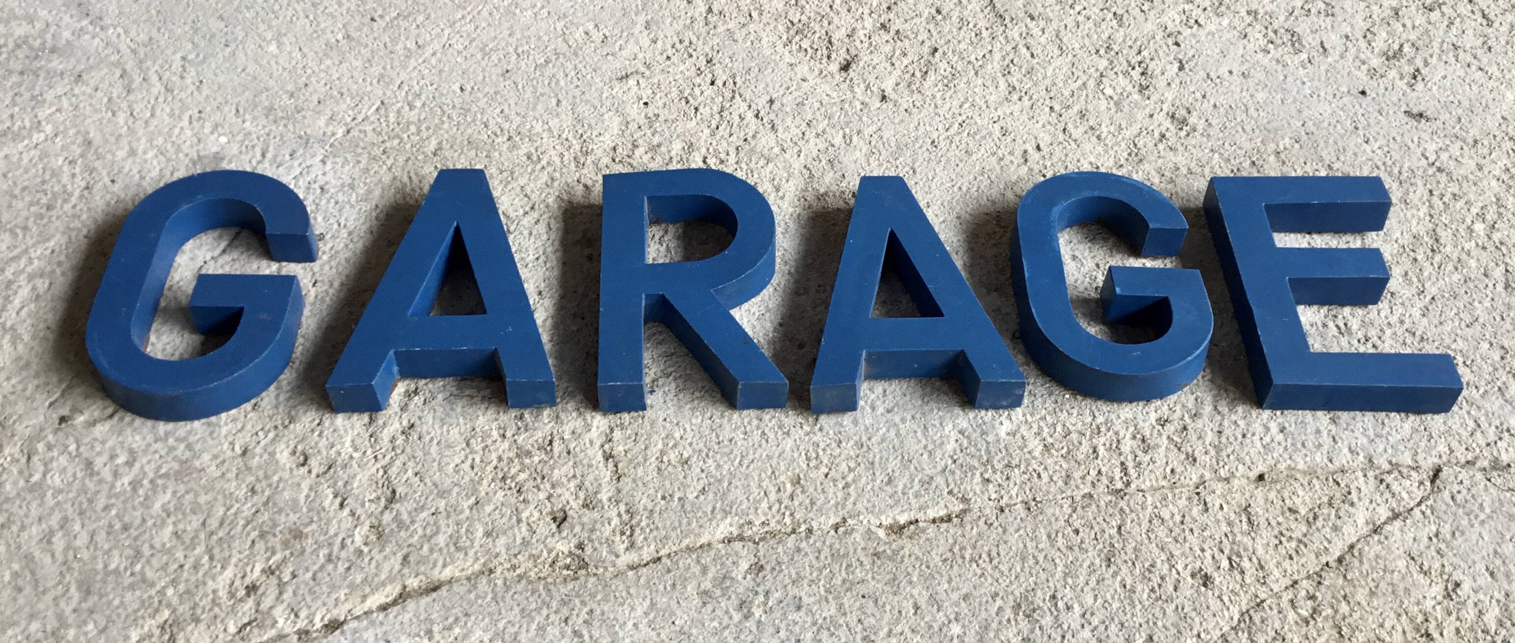 Metal sign letters forming the word GARAGE - vintage workshop