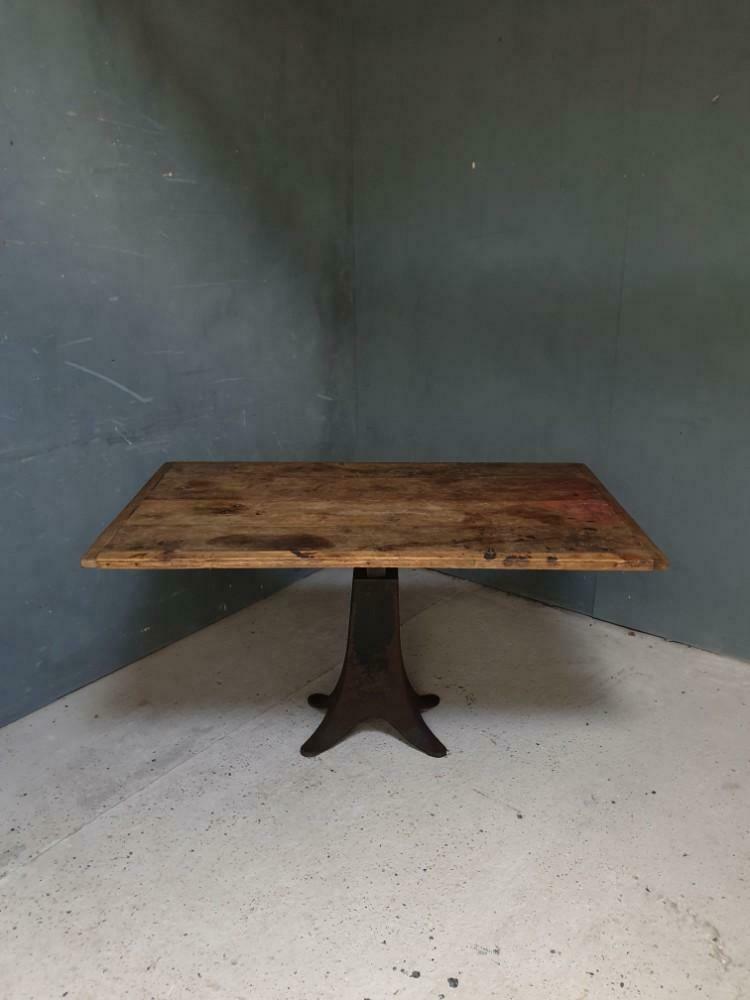 Old table on cast iron machine leg