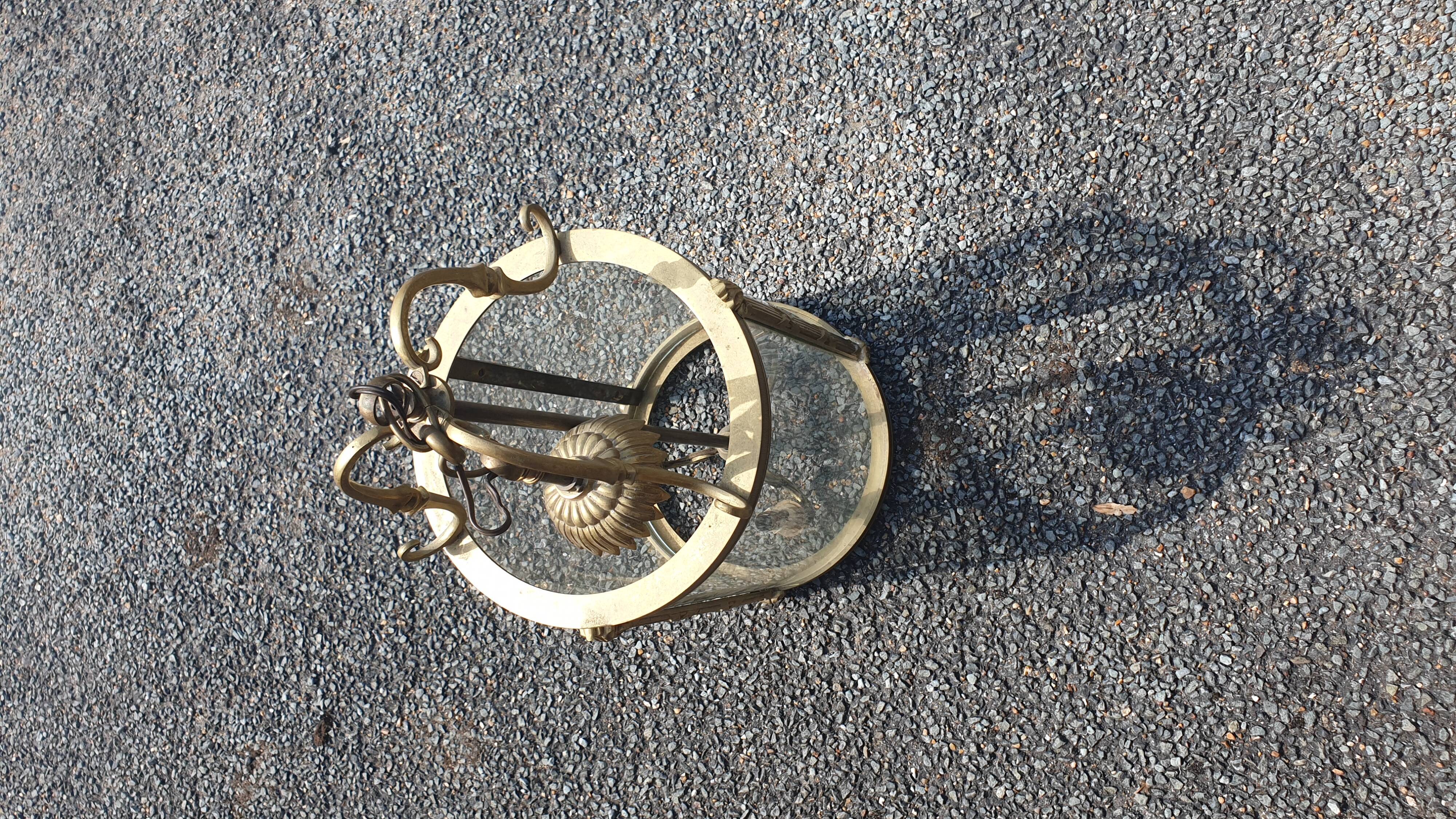 Suspension in glass and brass