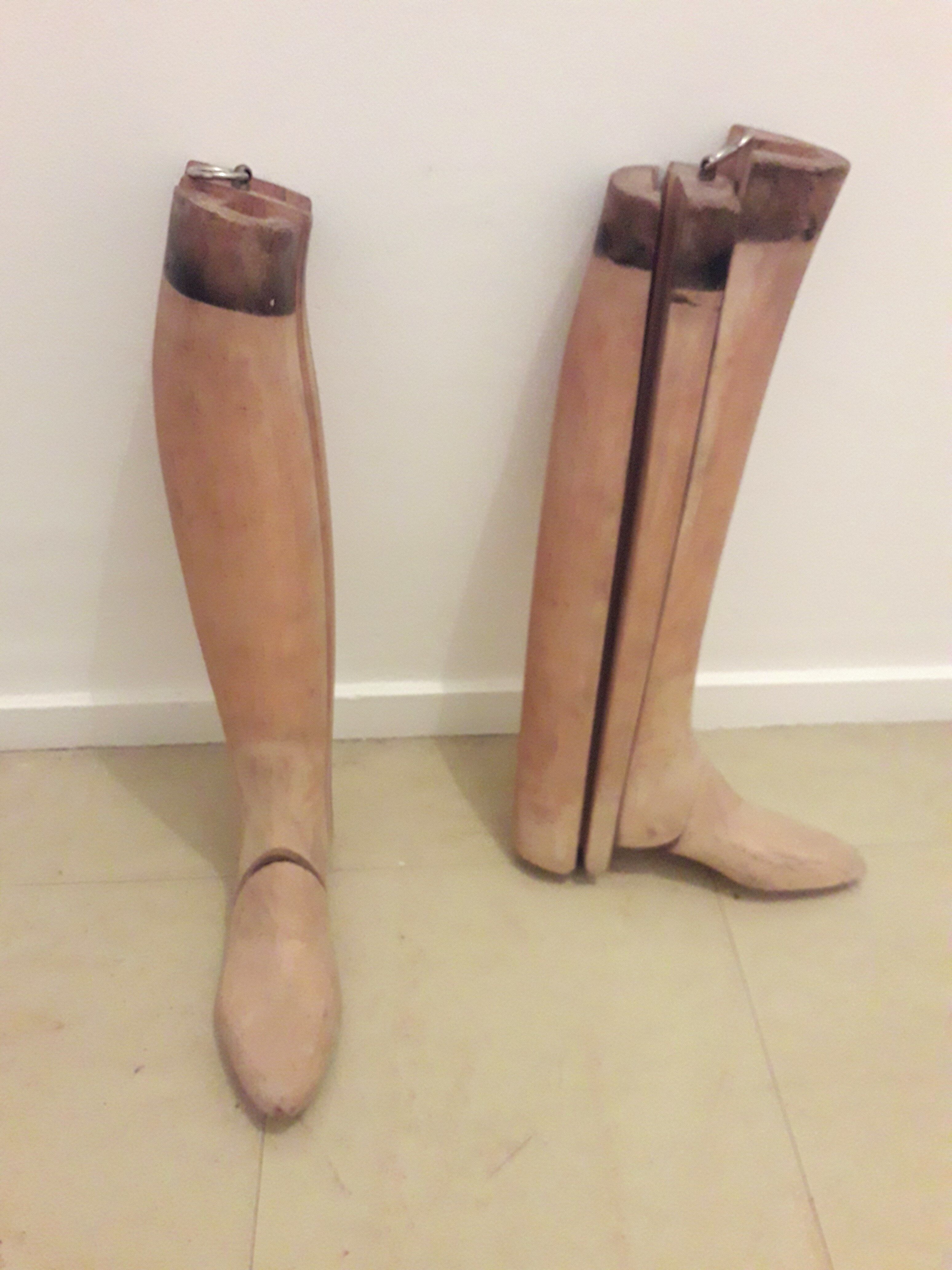 Old wooden shoe trees and their vintage leather rider boots. 1950