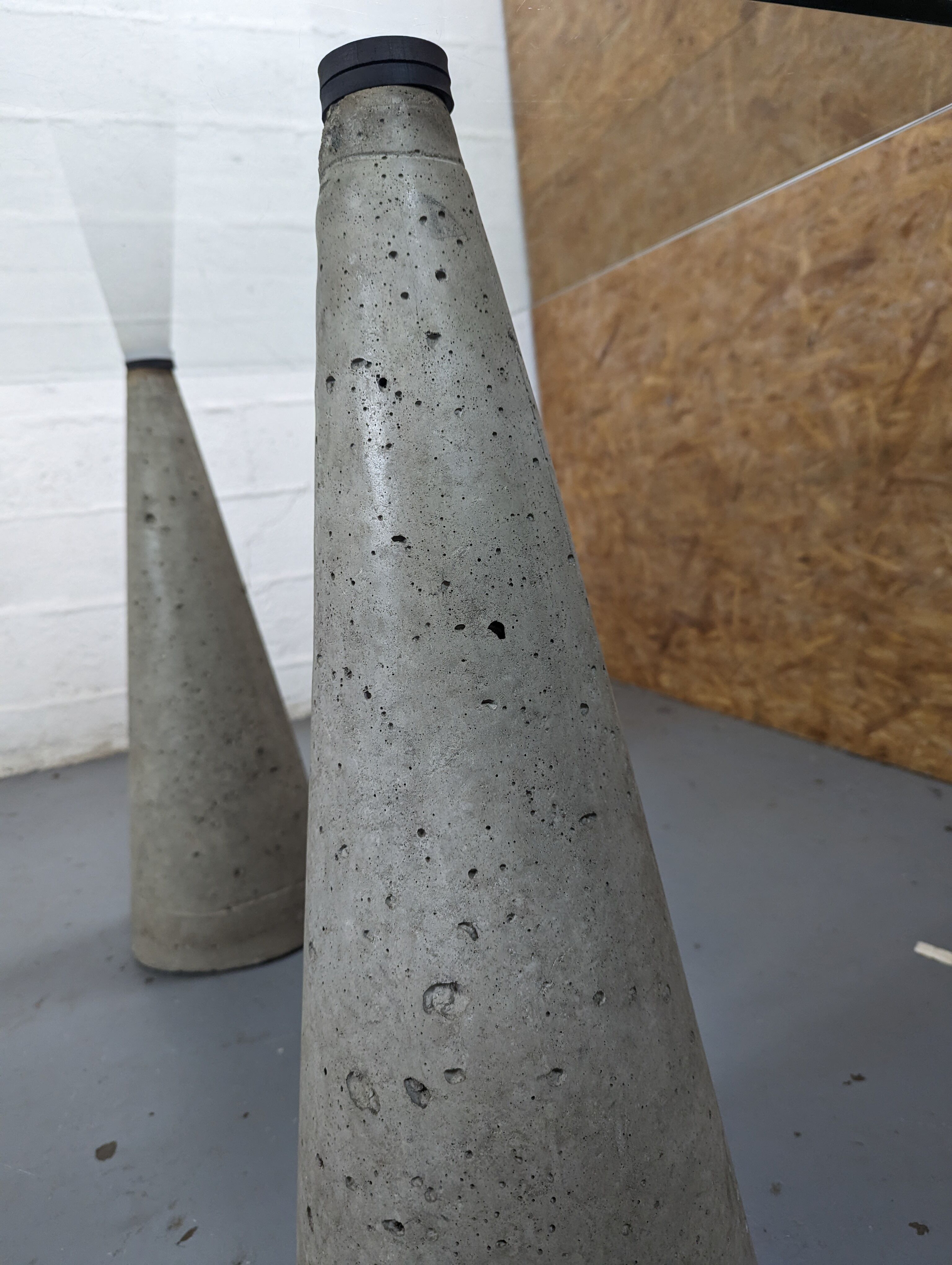 Glass table with cement legs