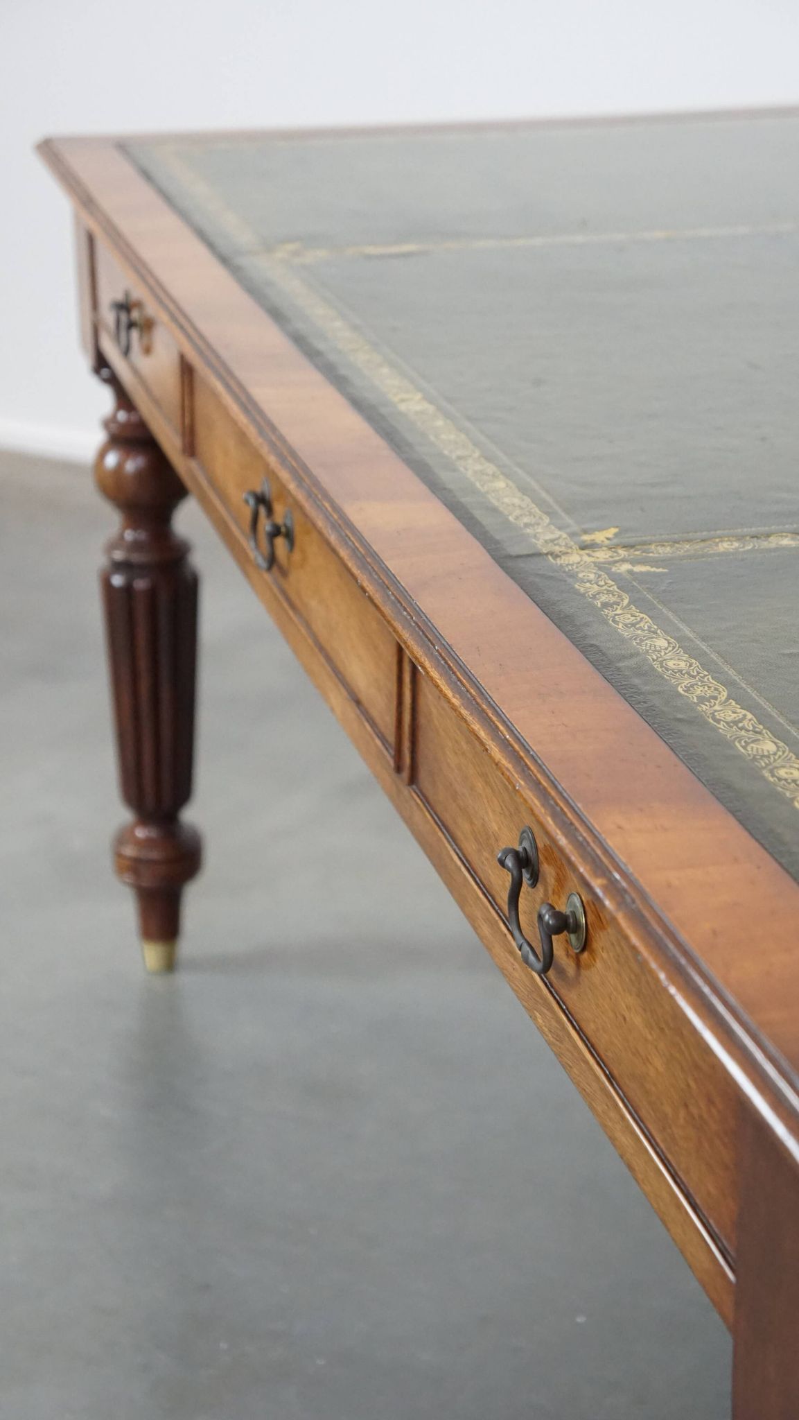 Large writing desk with green leather top, elegant legs and 3 English style drawers