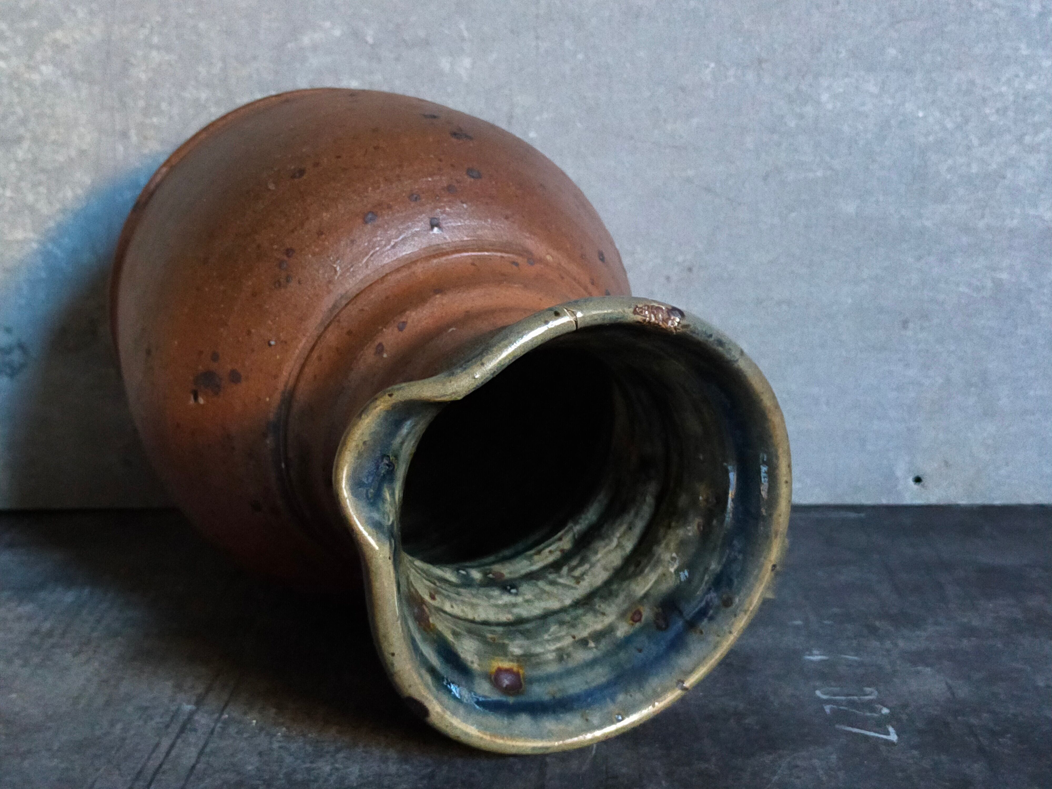 Pitcher traditional pottery Folk art in old enamelled sandstone