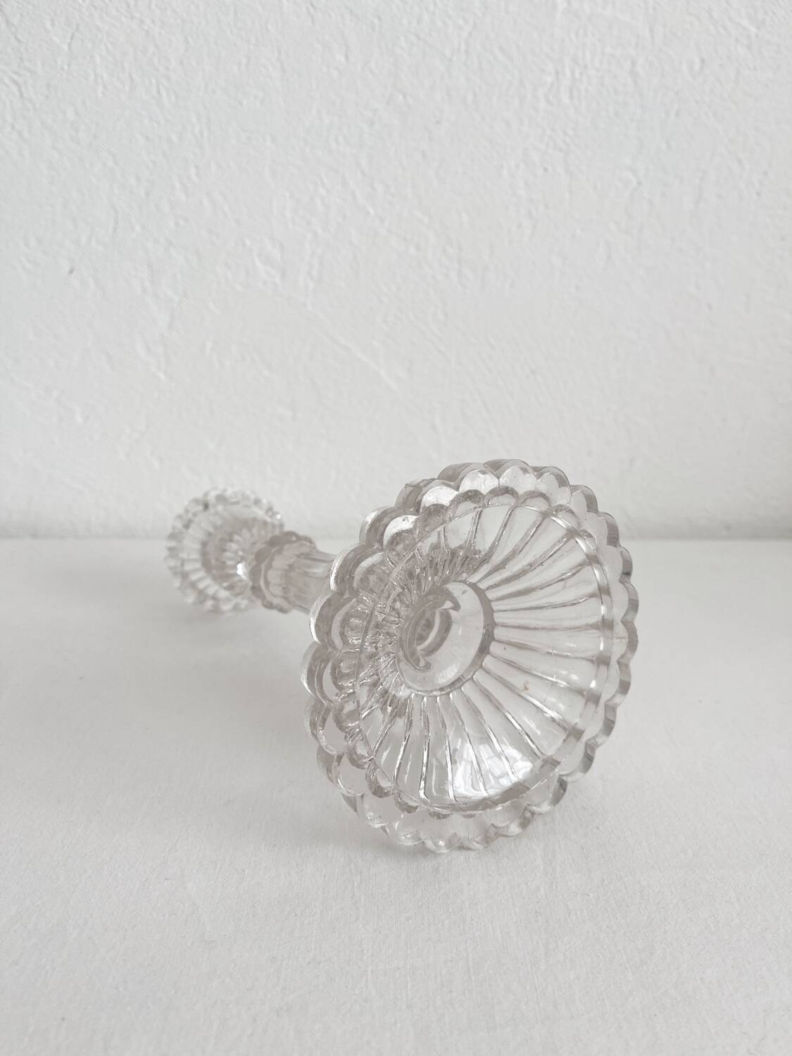 Antique baluster-shaped molded glass candlestick holder
