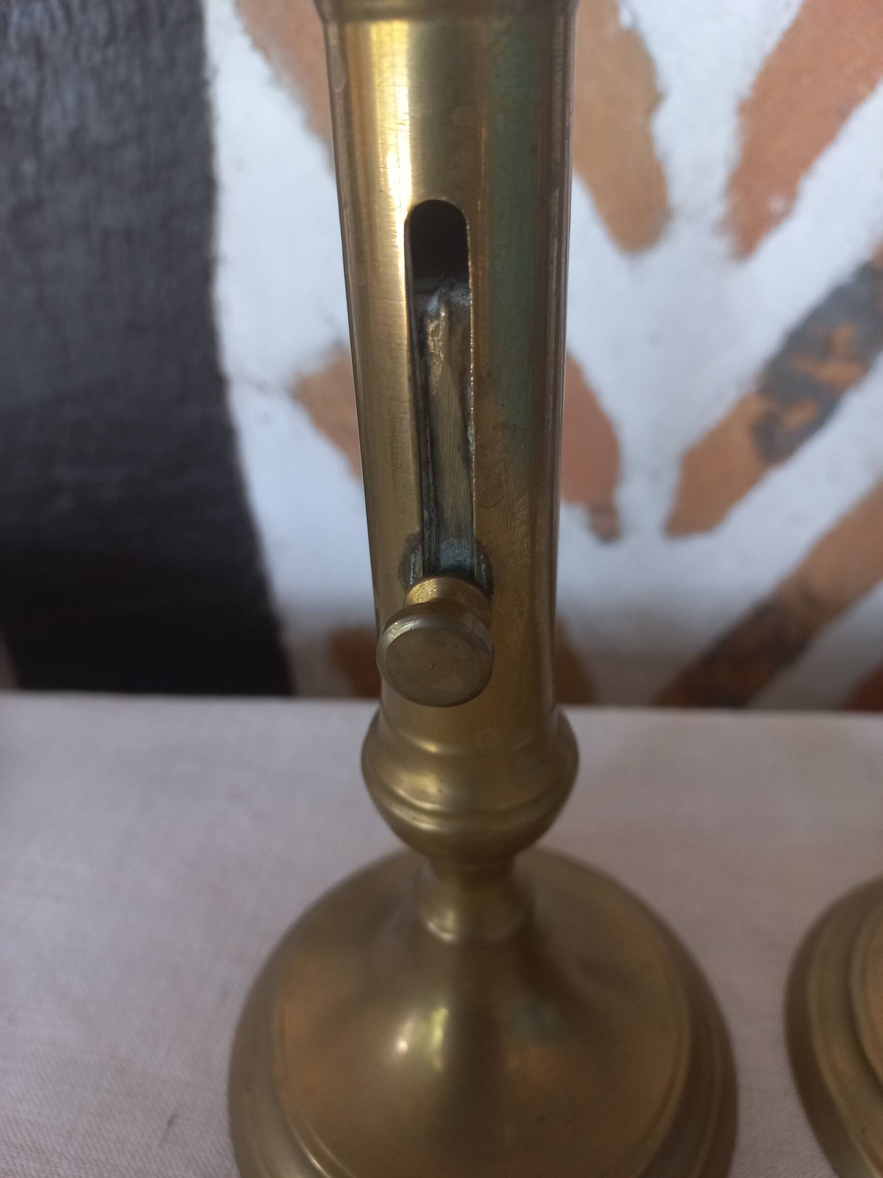 Pair of brass push-button candlesticks