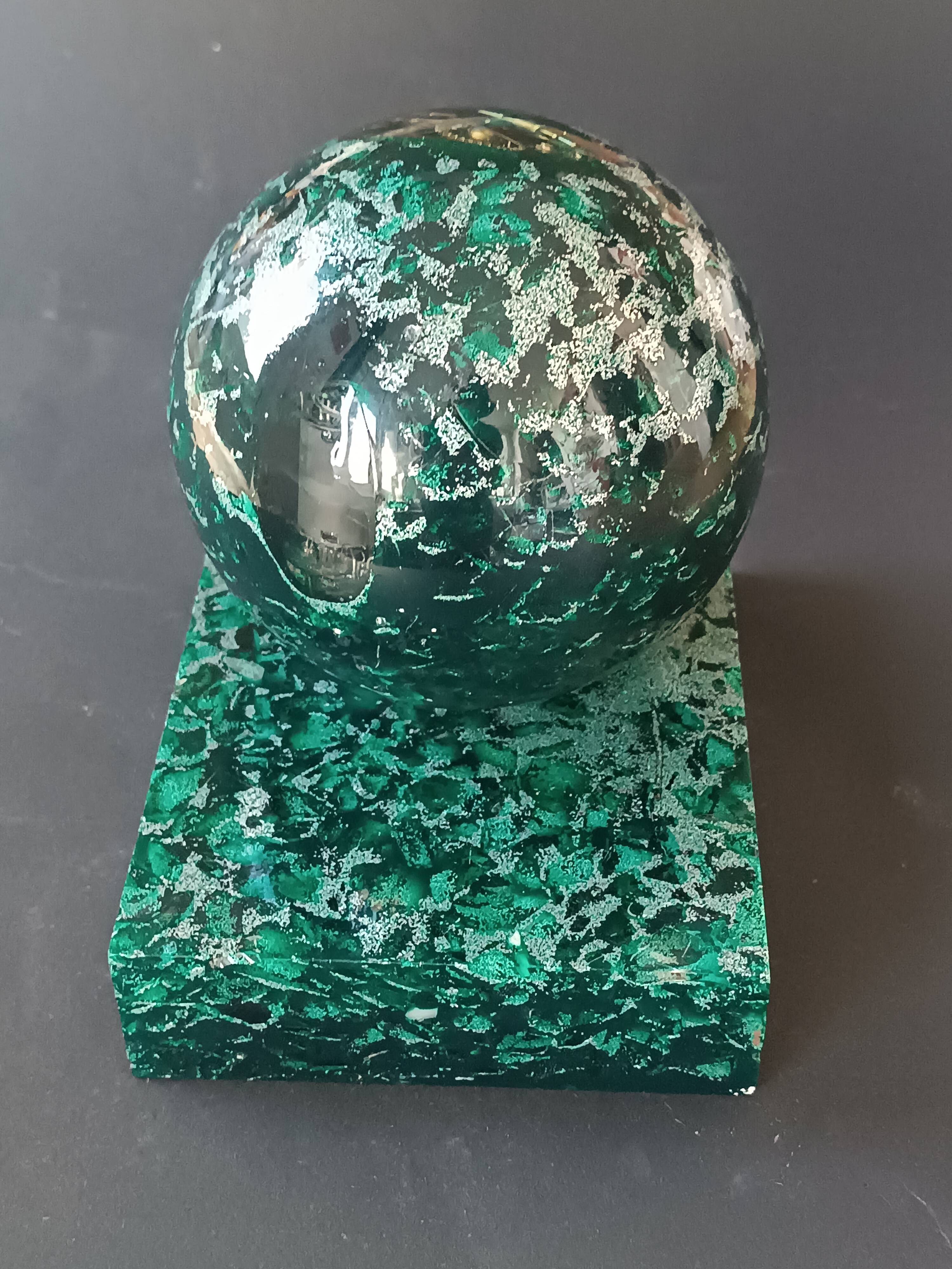 Design bookends in fractal resin with watchmaking inclusions.