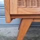 Commode vintage pied compas et rotin