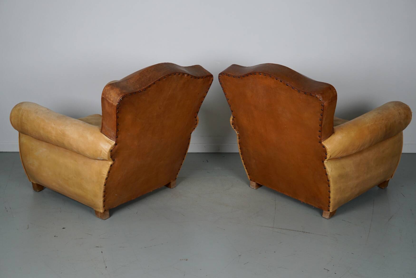 Pair of French Cognac Moustache Back Leather Club Chairs, 1940s