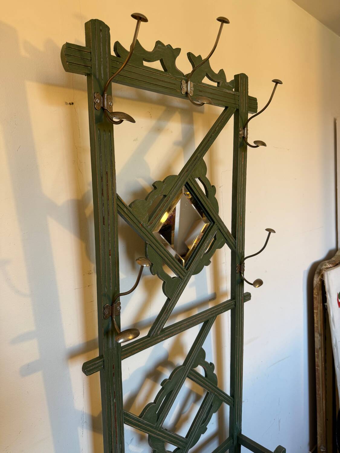 Art Deco coat rack in green patinated wood