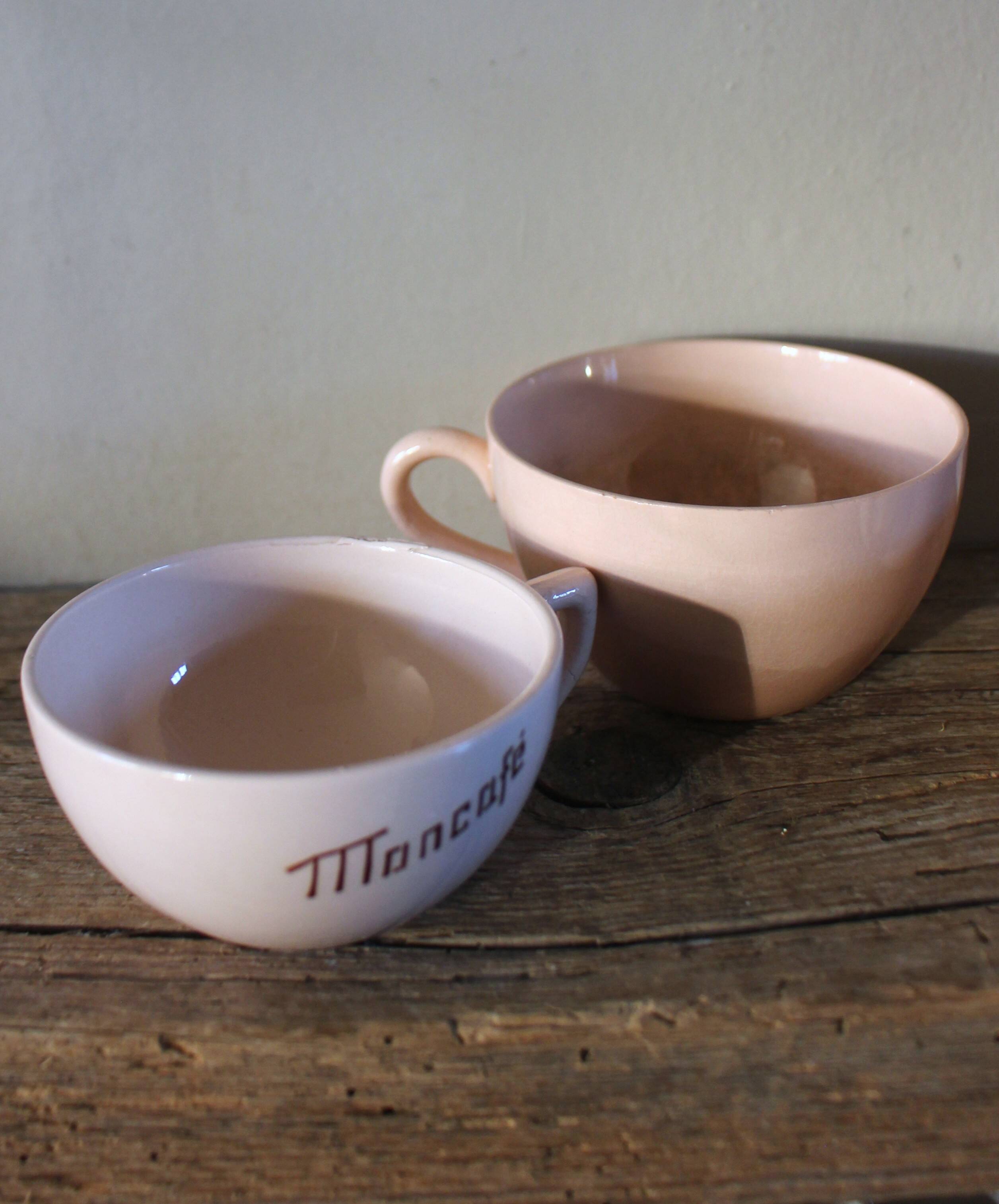 A set of 3 pink earthenware cups from Digoin Sarreguemines.