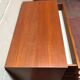 Brown teak Mid-Century chest of drawers with 7 drawers from the 1960s, sleek lines, discreet base.