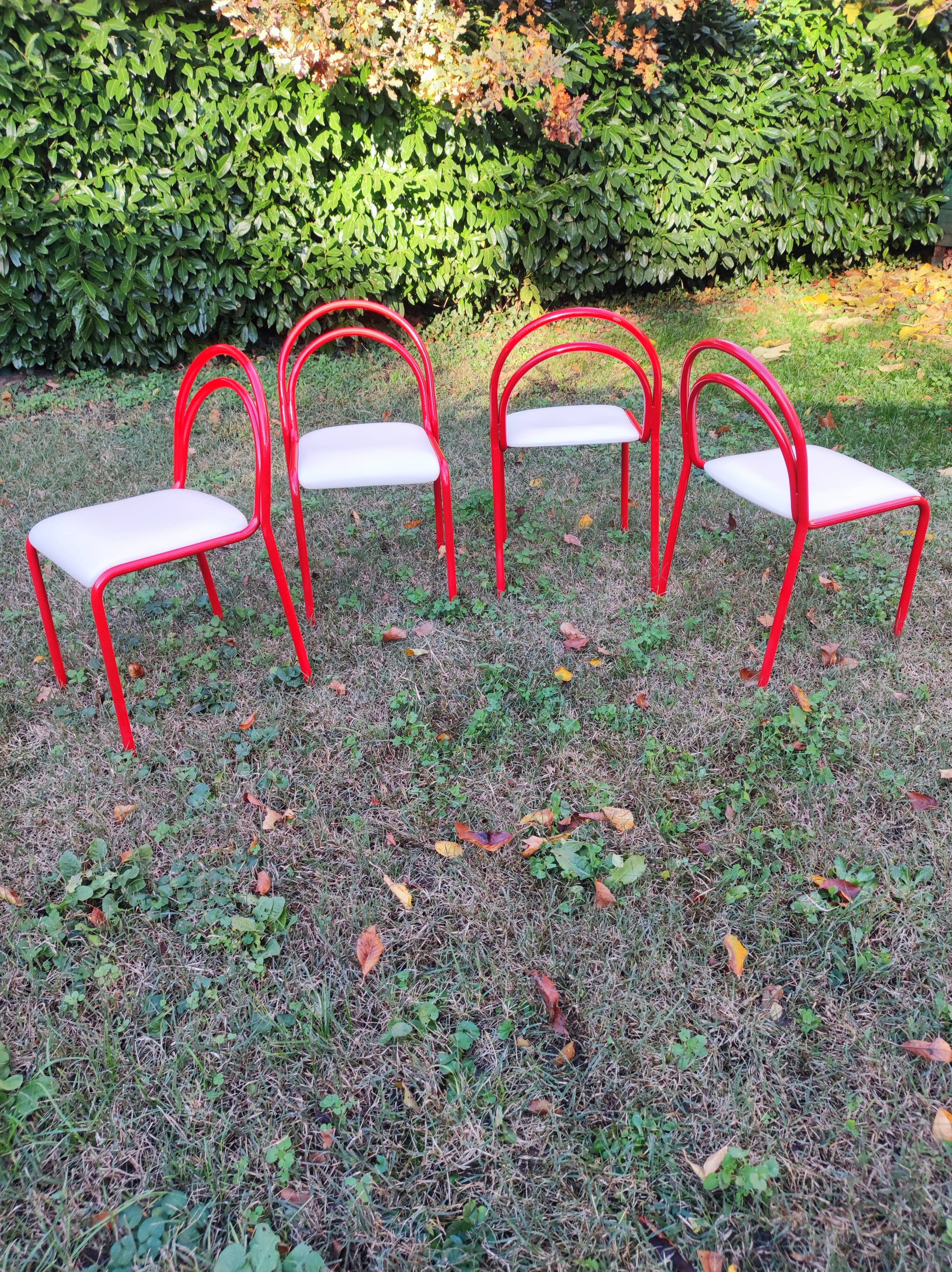 Stackable chairs, Italy, 1980s, red metal, white vinyl