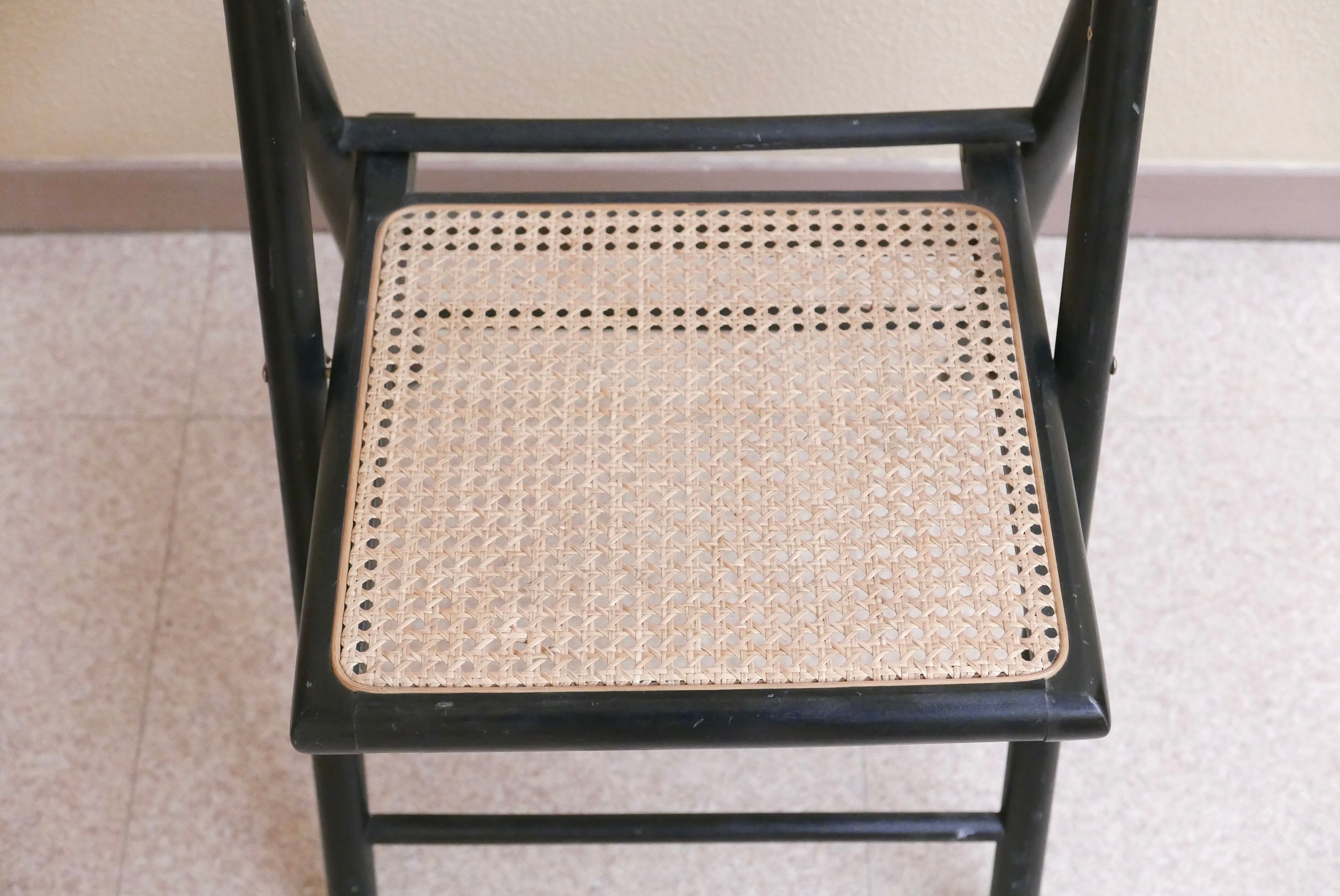 Black folding chair, 70s