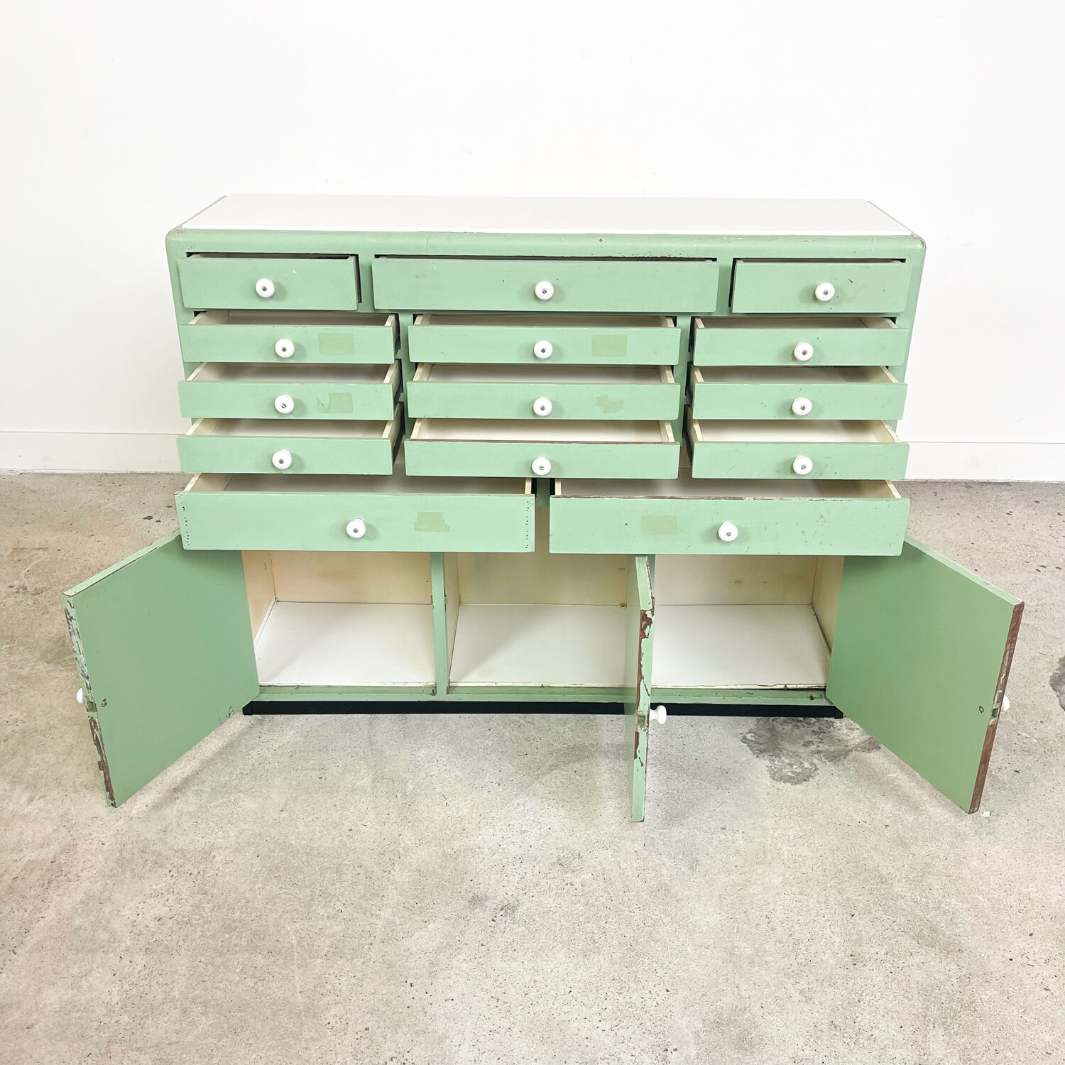 Vintage mint green dentist drawer unit with opaline glass top