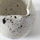 Small speckled ceramic jug in a vintage workshop style.