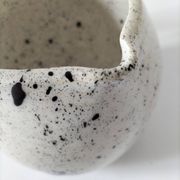 Small speckled ceramic jug in a vintage workshop style.