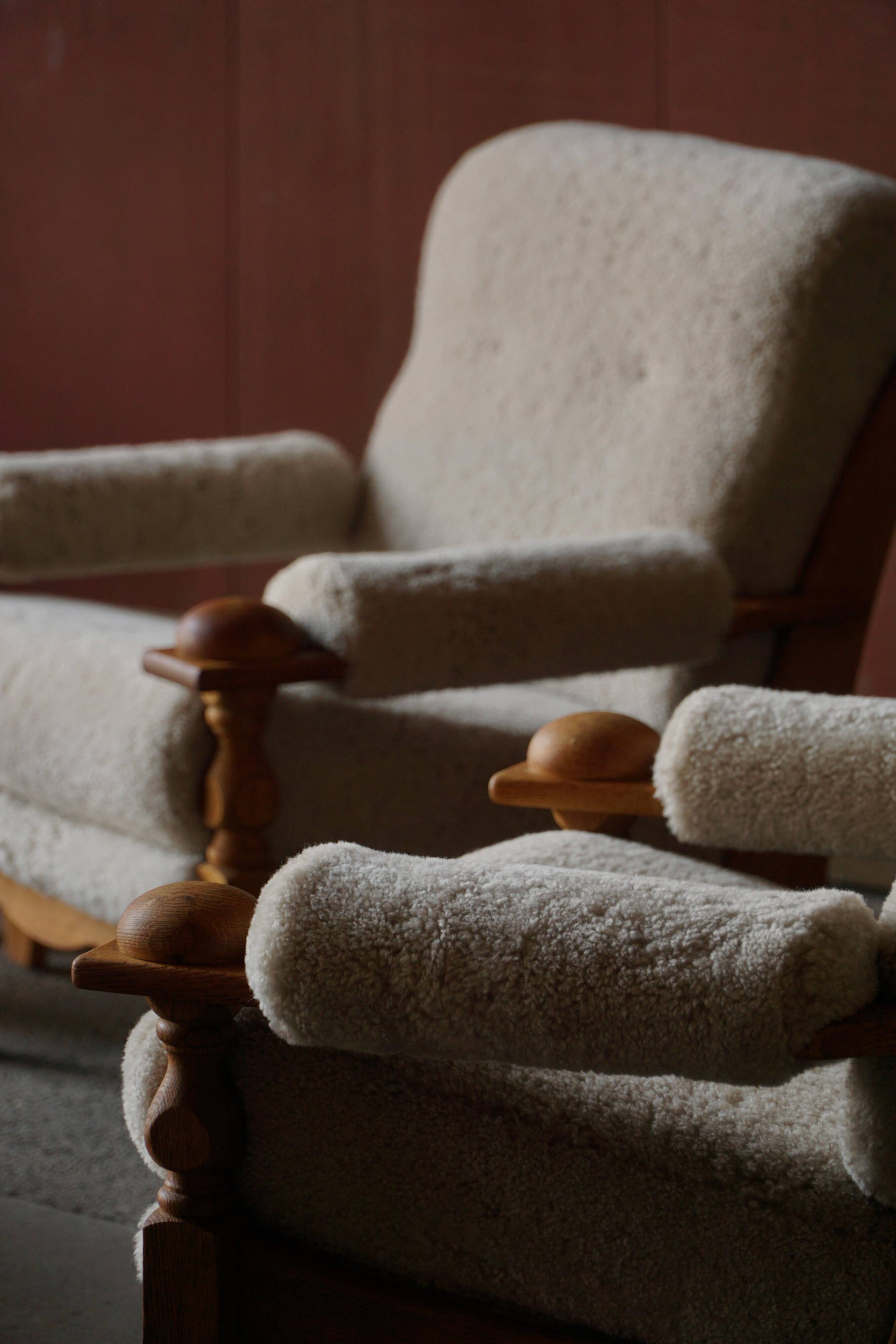 Henning Kjærnulf, lounge chairs in oak and lambswool, mid-century Danish, 1960s.