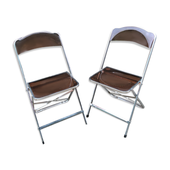 Transparent folding chairs pair