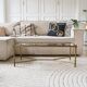 Coffee table in gold metal and glass