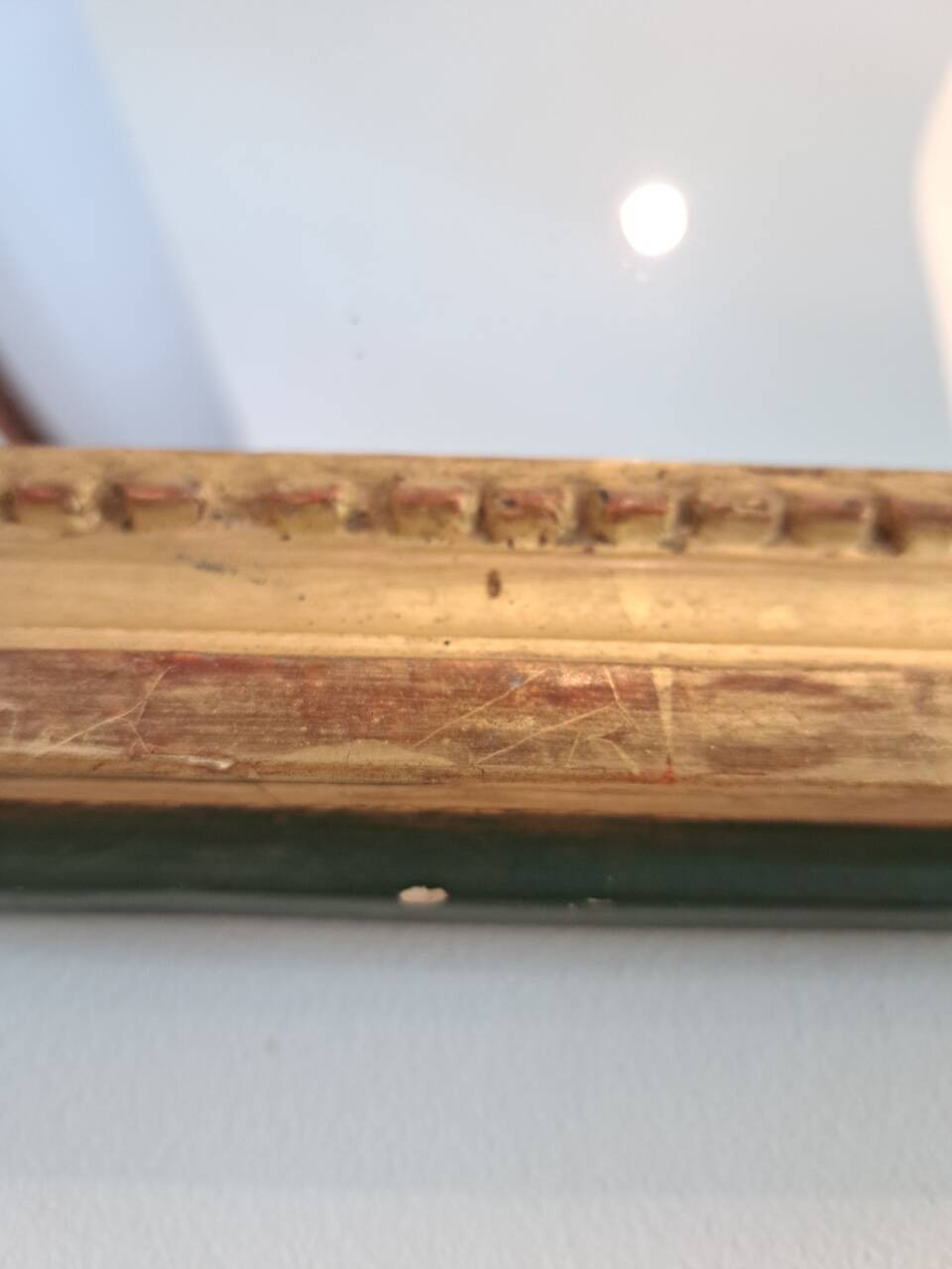 Antique mirror in wood and gilded stucco