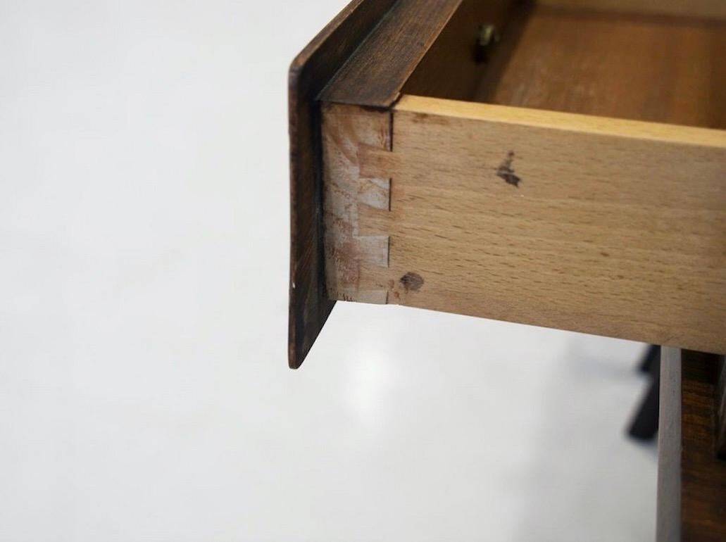 Pair of modernist Italian bedside tables in wood with a glass top.