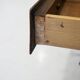 Pair of modernist Italian bedside tables in wood with a glass top.