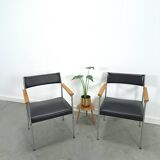 Chaises DDR avec base chromée et revêtement noir, chaises de salle à manger
