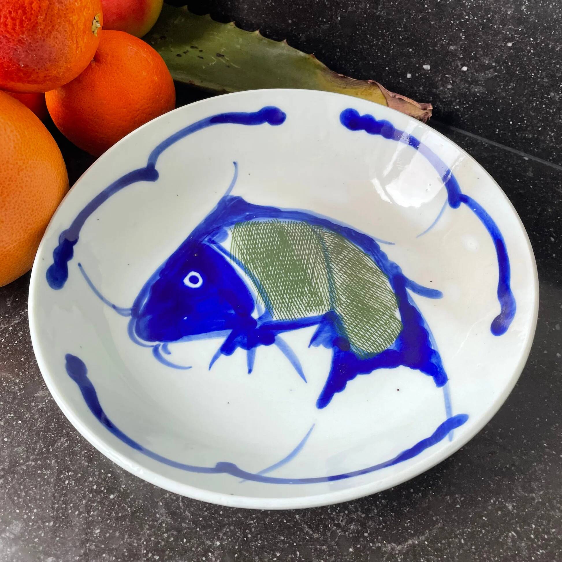 Hand-painted Chinese porcelain bowl with blue fish