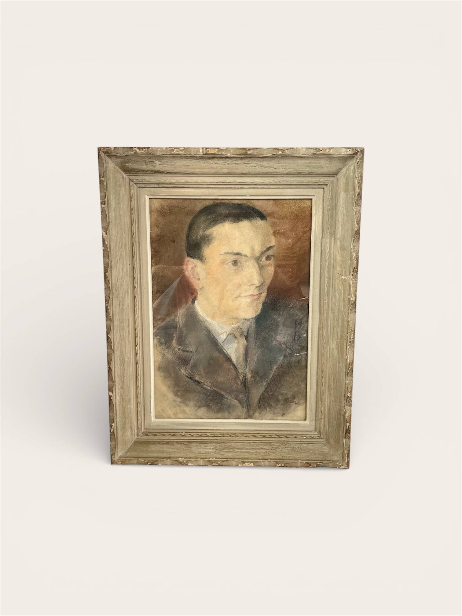 Portrait of a man in pastel under glass, signed, early 20th century.