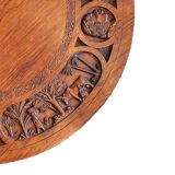 Circular tripod coffee table in carved wood