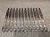 12 silver-plated dessert knives by St Medard, rocaille style, Florian.