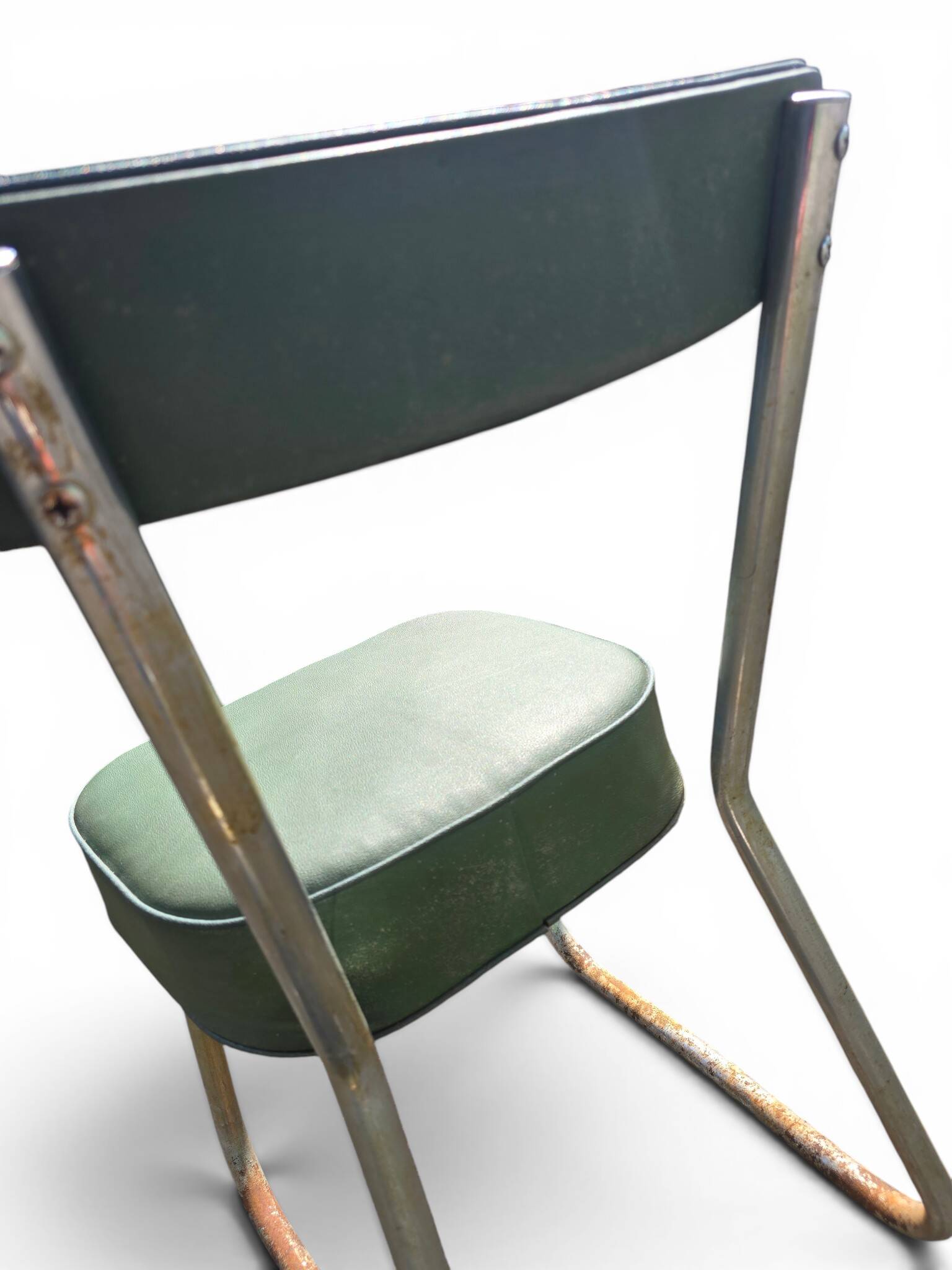 Vintage green faux leather chair with metal frame, 1960s.