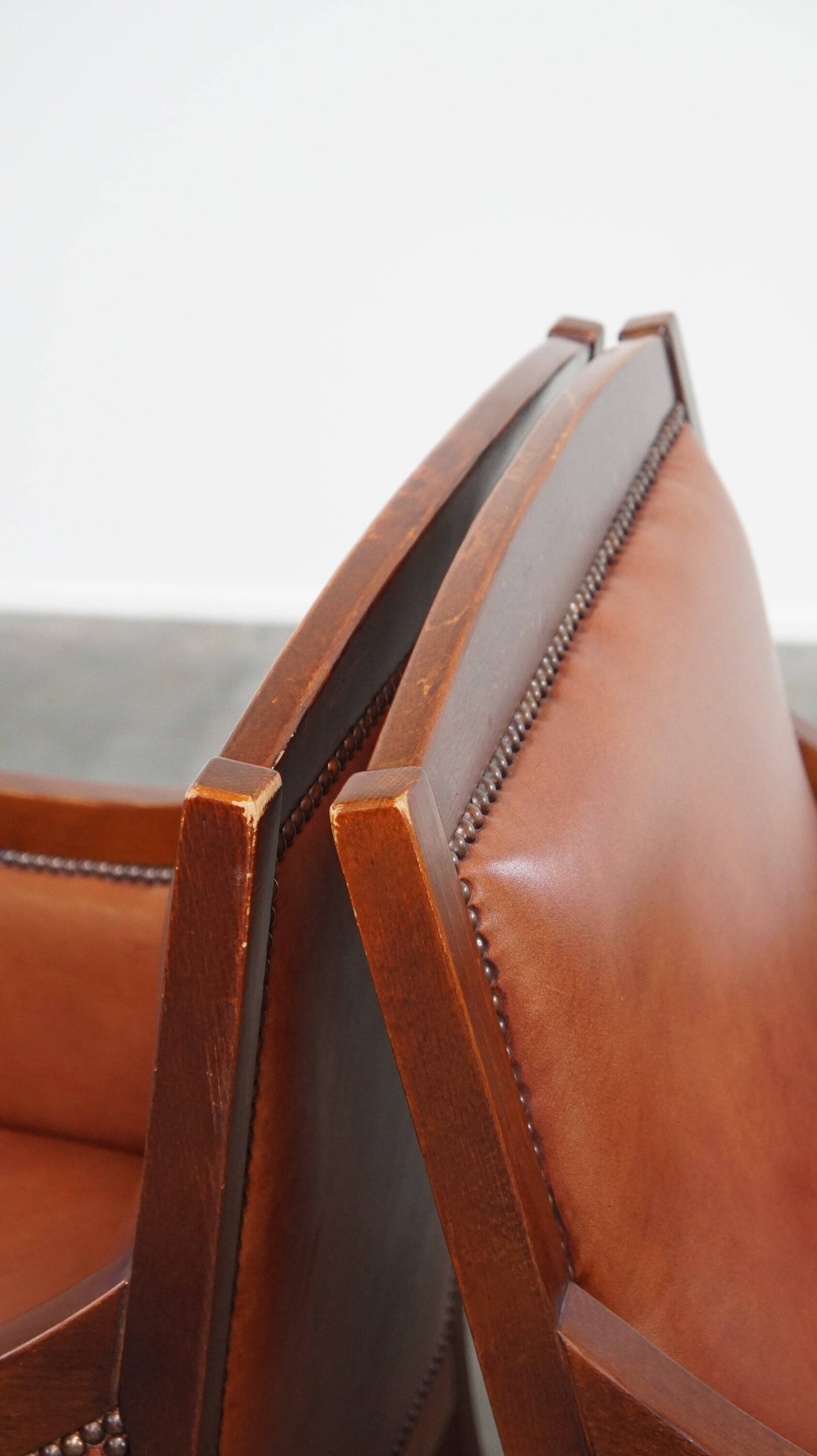 Set of 2 cognac-colored cowhide Art Deco design armchairs