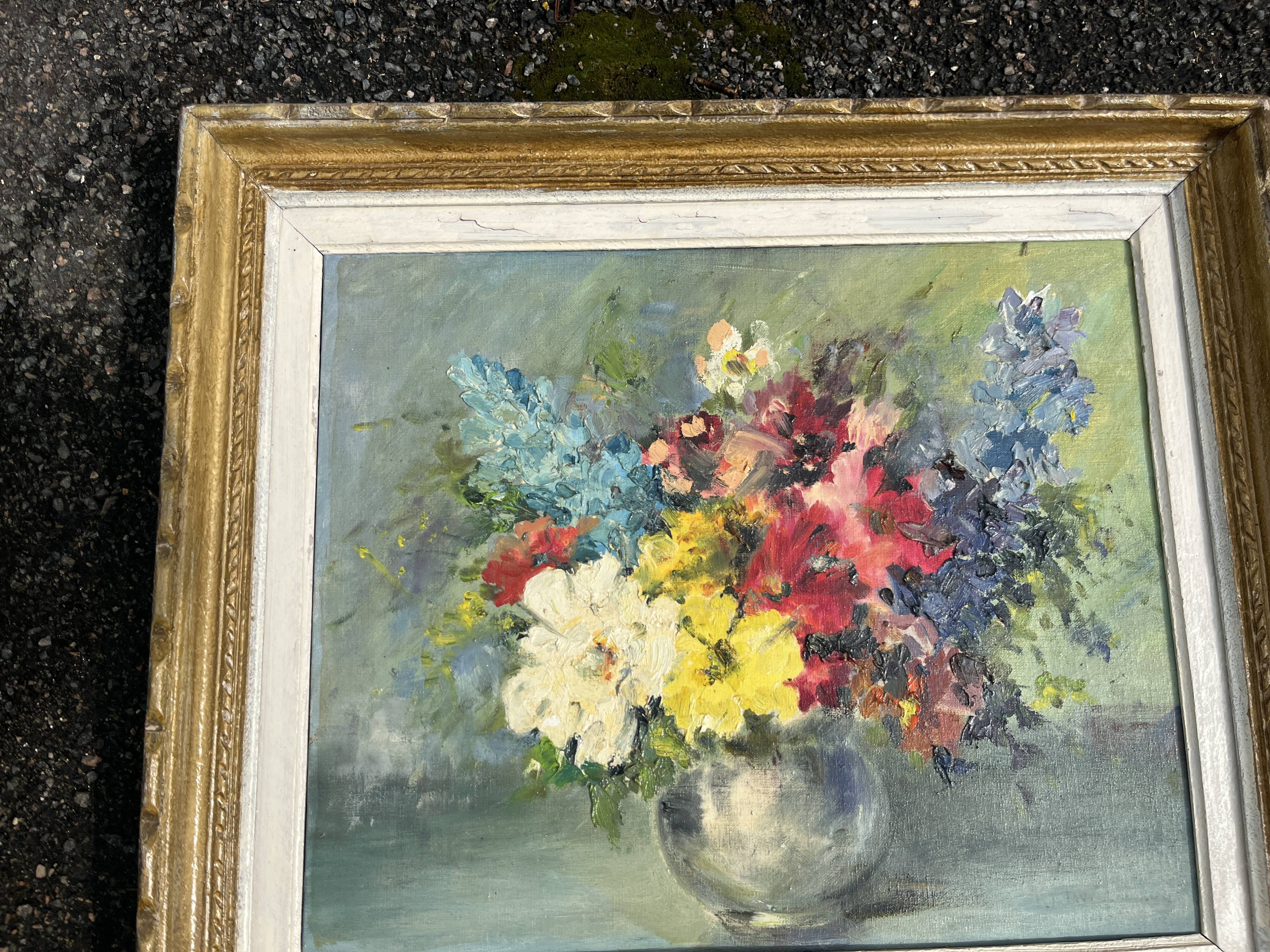 Still life of flowers in Impressionist style with a golden frame.