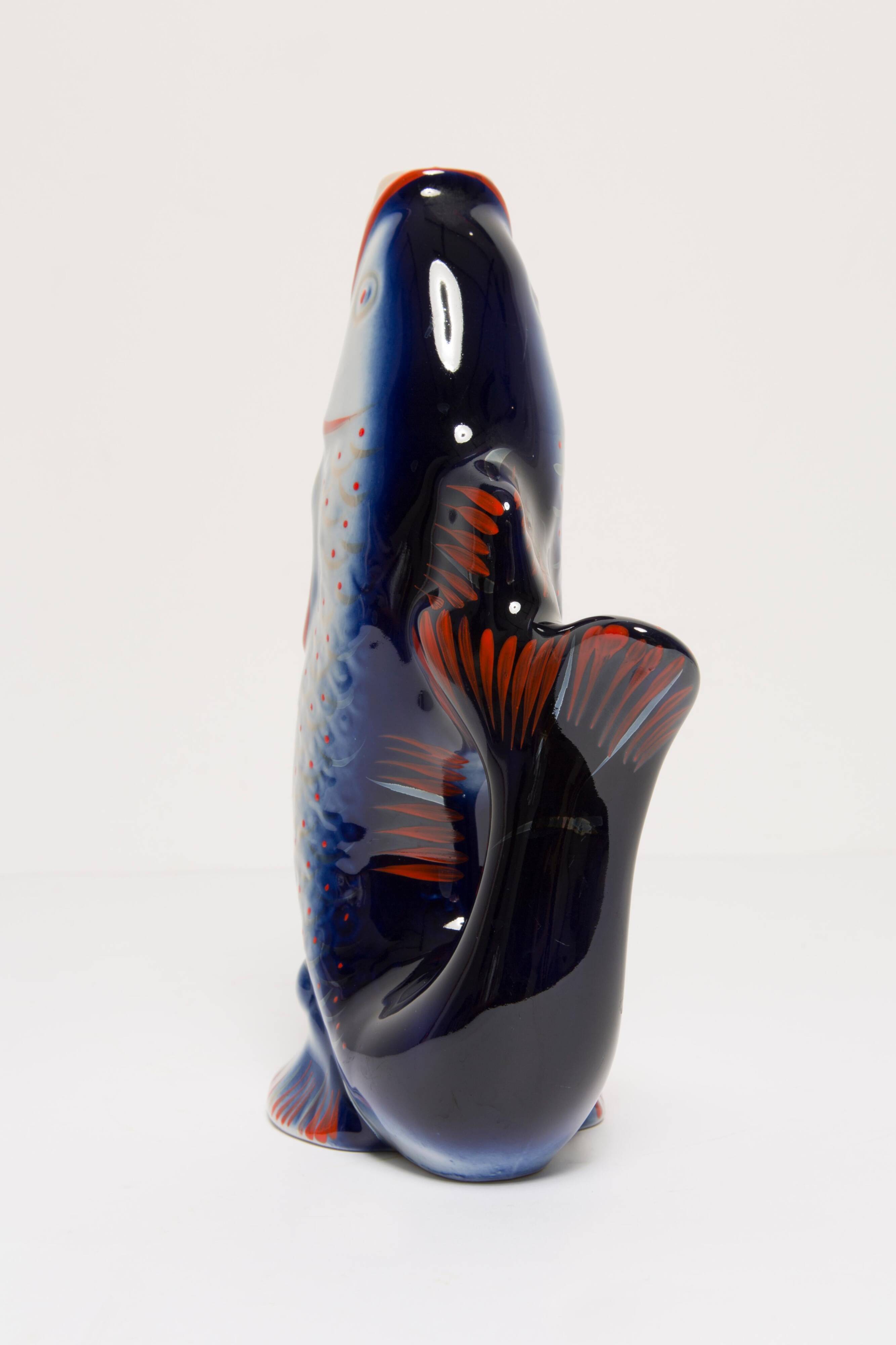 Set of 7 blue glass fish, mid-20th century.