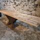 Old French industrial table with a cast iron base and a pine top.