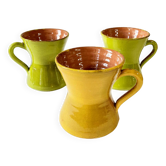 3 large green and yellow enameled ceramic cups, signed